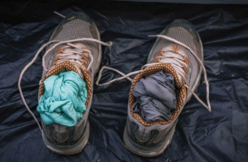 dry clothes in wet shoes camping trick