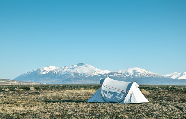 cold climate campsite with an insulated tent set up in the distance