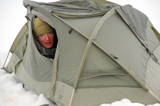 thermal blanket sitting atop a tent to provide insulation