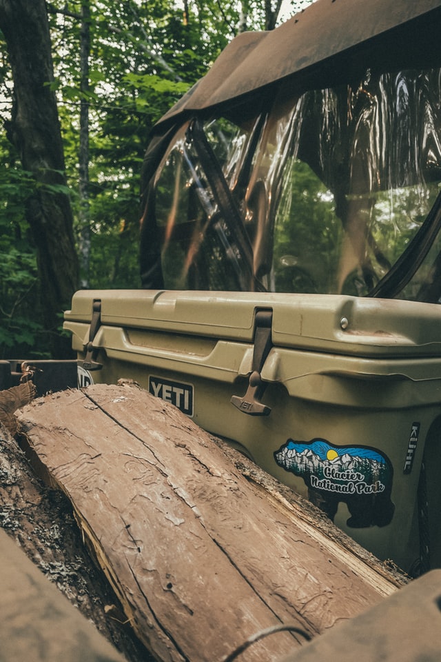 a Yeti camping cooler sitting on a campsite