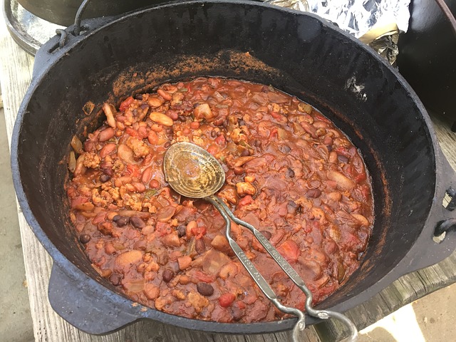 red chile and beans in a camping dutch oven