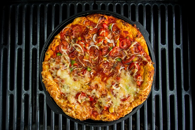 top view of a pizza cooking in a dutch oven